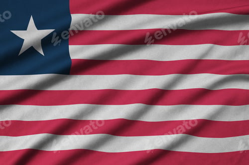 Preview: Liberia flag is depicted on a sports cloth fabric with many folds. Sport team waving banner