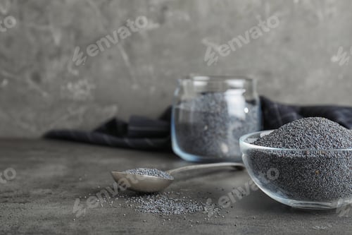 Preview: Poppy seeds in bowl and spoon on table. Space for text