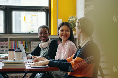 Preview: Group Of Students Studying In The Library
