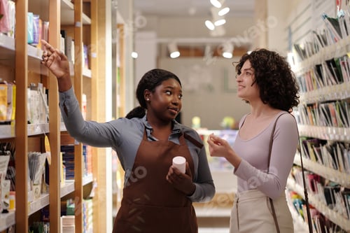 Preview: Customer and shop assistant by display
