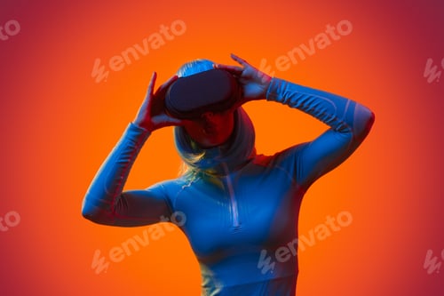 Preview: Futuristic woman in VR glasses screaming