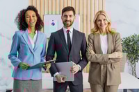 Preview: Group of multiethnic businesspeople standing at computer desk in the office