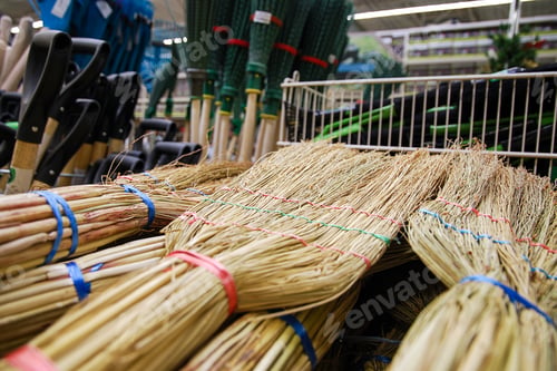 Preview: Natural and plastic brooms, shovels and household tools in store