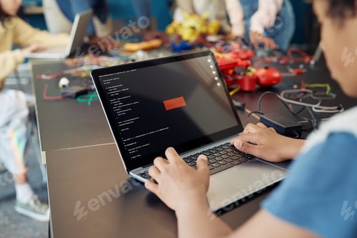 Preview: Boy Using Laptop in Engineering Class