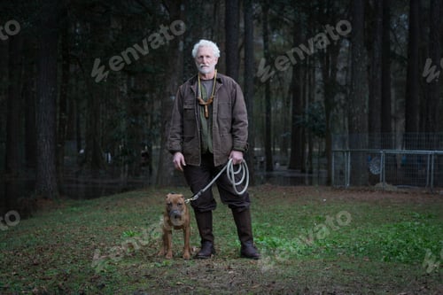 Preview: Man and pet dog on lead
