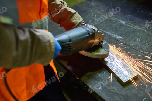 Preview: Man Working with Metal at Factory