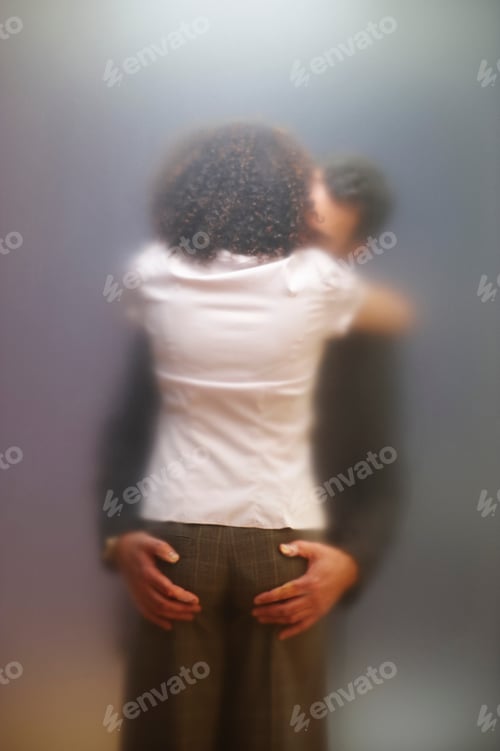 Preview: Co-workers kissing behind frosted screen