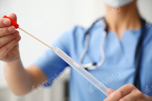 Preview: Doctor holding buccal cotton swab and tube for DNA test in clinic, closeup