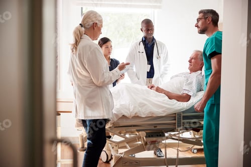 Preview: Medical Team On Rounds Meeting Around Bed Of Senior Male Patient