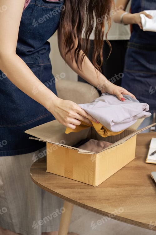 Preview: Female owner online store small business entrepreneur packing package shipping box preparing