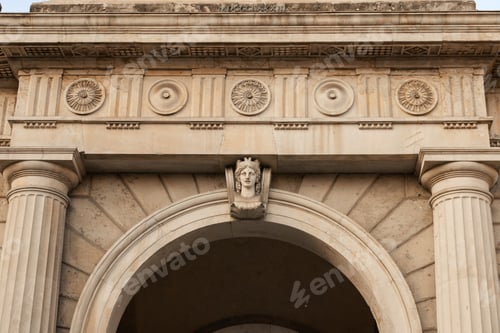 Preview: ornate stone arch with columns and carved face