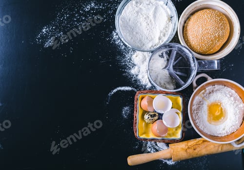 Preview: Ingredients and utensil for baking on the black board, top view