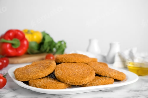 Preview: Delicious fried breaded cutlets on white marble table