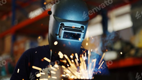 Preview: Welders welding steel in factory, Welders with protective mask