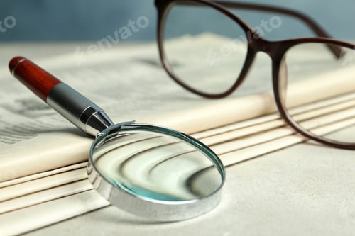 Preview: Stack of newspapers, magnifier and glasses on table. Search concept