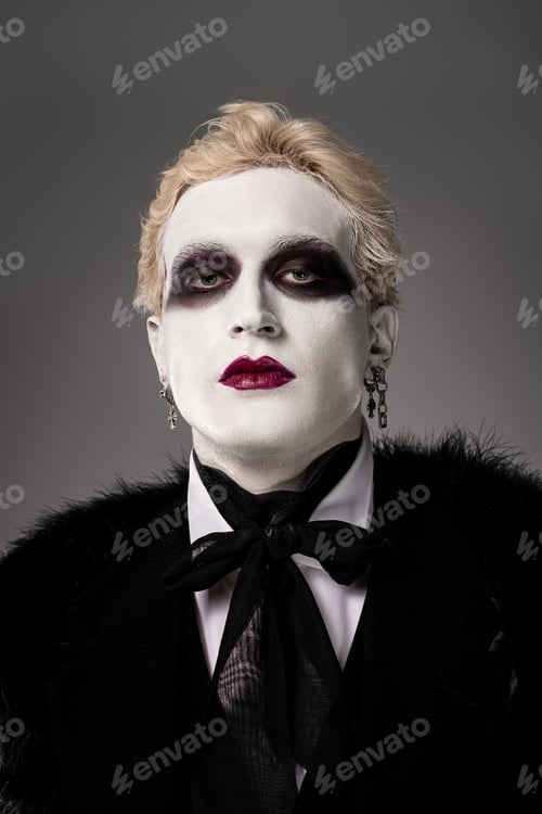 Preview: Young man in stunning Halloween costume captivating with unique style and makeup