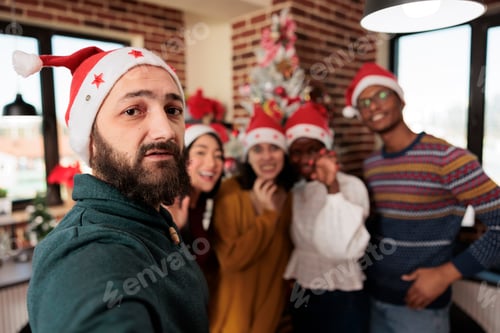 Preview: Workers taking selfie at christmas party