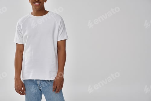 Preview: stylish african american man in trendy casual jeans and white t-shirt, copy space for advertising