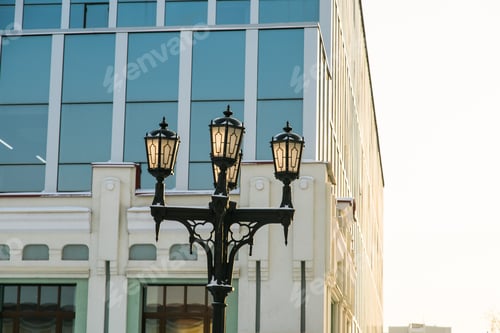 Preview: Street light in city winter season on background a hotel building. Copy space and empty place for