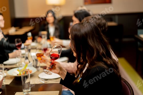 Preview: work colleagues in a restaurant celebrating conclusion of a new deal a successful business proposal
