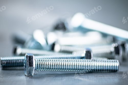 Preview: Working tool. Bolts on a gray background.