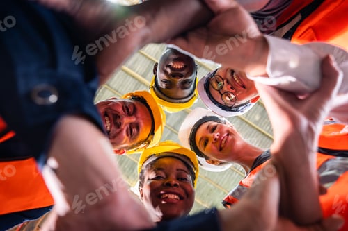 Preview: Group of diverse industrial worker work together in manufacturing plant. A