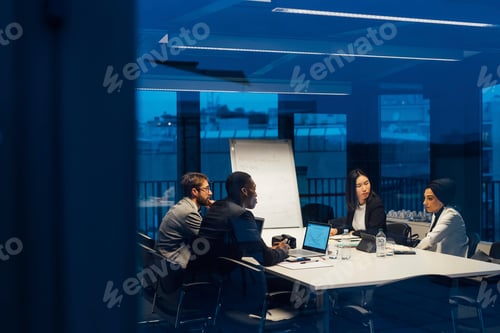 Preview: Businessmen and women having discussion during conference table meeting