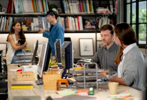 Preview: Caucasian business man and woman with casual cloth discuss together in office