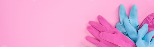 Preview: panoramic shot of blue and pink rubber gloves on pink background with copy space
