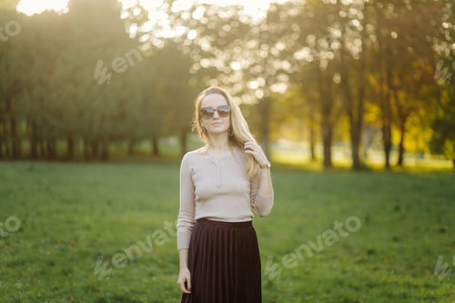 Preview: Young Woman Posing Over Yellow Leaves Park