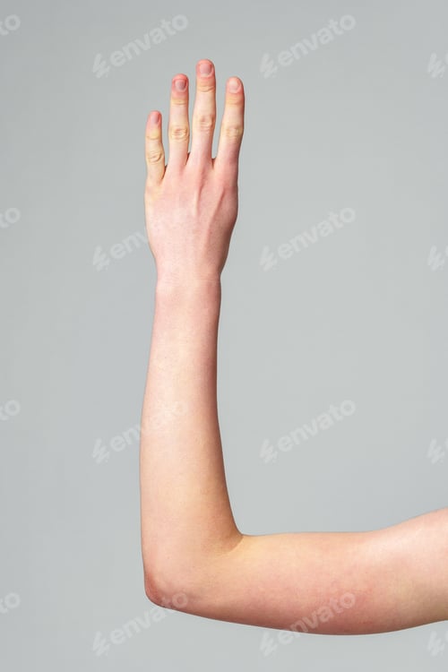 Preview: Extended Human Arm Against a Neutral Grey Background Demonstrating Flexibility