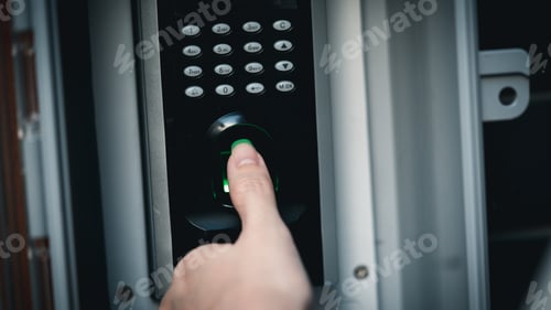 Preview: Close up hand of woman press down the finger on fingerprints scan machine for unlock door.
