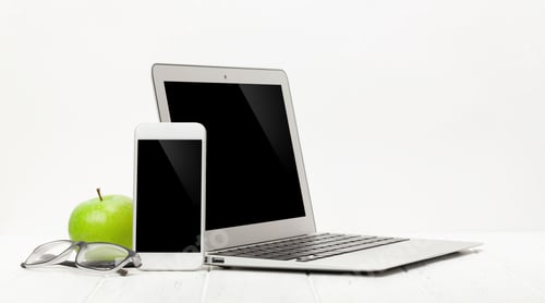 Preview: Workplace with laptop, smartphone, supplies