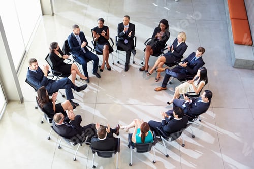 Preview: Multi-Cultural Office Staff Applauding During Meeting