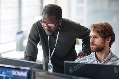 Preview: Black Man Mentoring IT Developer and Reviewing Code