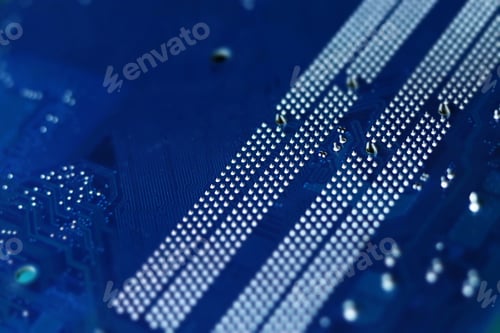 Preview: Dark blue computer motherboard closeup in tilt shift style