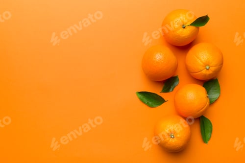Preview: fresh Fruit orange slices on colored background. Top view. Copy Space