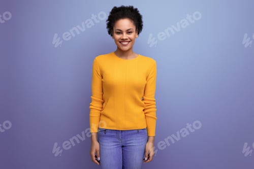 Preview: cheerful young 25 year old hispanic lady with afro tail in studio background with copy space