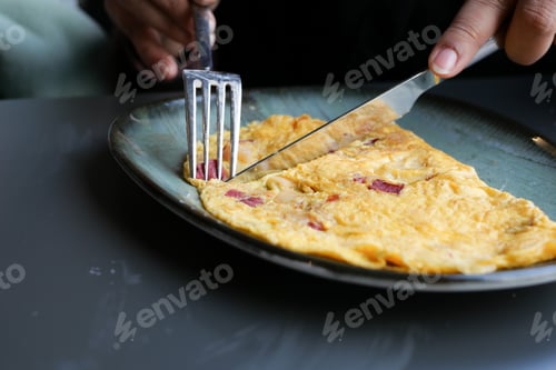 Preview: eating Plain Egg Omelette on table