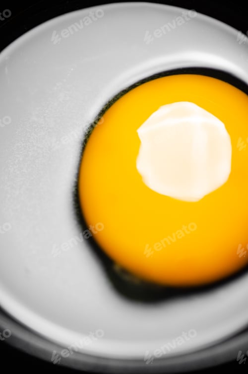 Preview: Chicken yolk from an egg in cup.