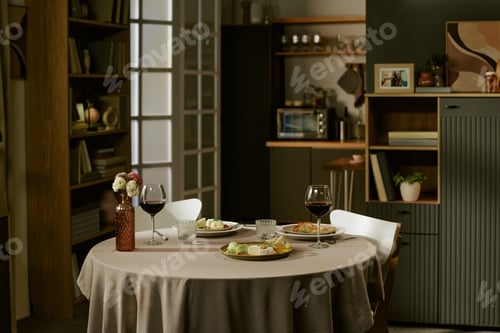 Preview: Romantic Dinner Table Setting Featuring Wine Glasses and Gourmet Appetizers