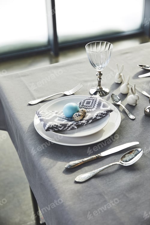 Preview: painted easter egg and quail eggs on plates