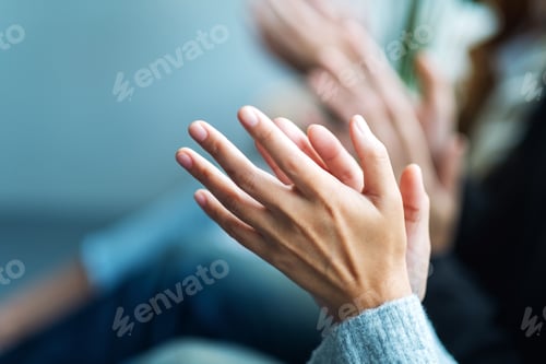 Preview: Closeup image of people clapping hands together