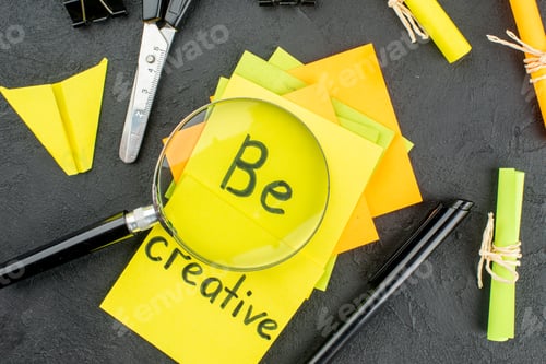 Preview: top view be creative written on yellow sticky notes scroll sticky notes scissors pen lupa on table