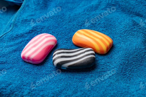 Preview: the three pieces of striped soap bars on the towel textile texture, spa and bathroom using