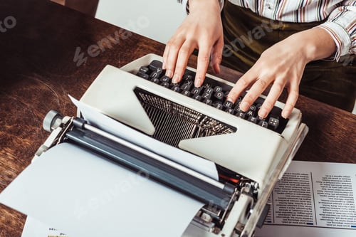 Preview: cropped image of retro styled african american writer typing on typewriter