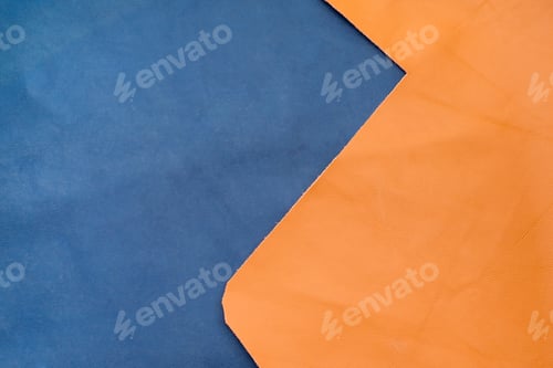 Preview: Close up navy blue and orange leather divide two section, texture background,fabrics Division
