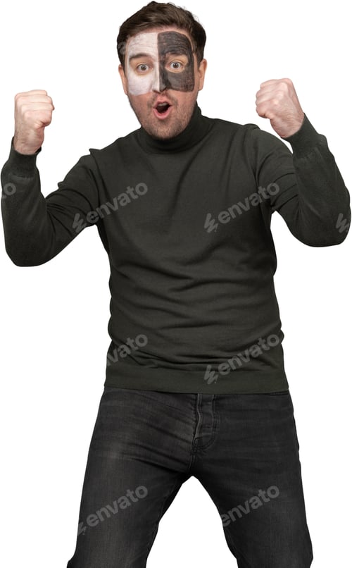 Preview: a man with a face mask on with his fists in the air