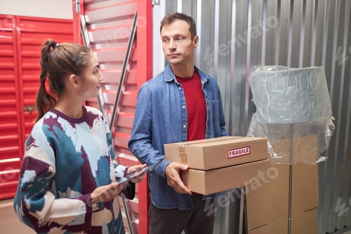 Preview: Couple Storing Packed Belongings in Warehouse