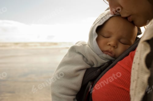 Preview: Mother with baby boy in sling